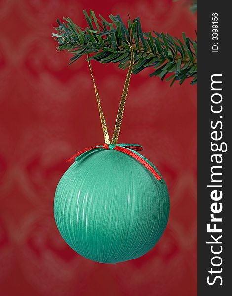 christmas ball hanging isolated on red background