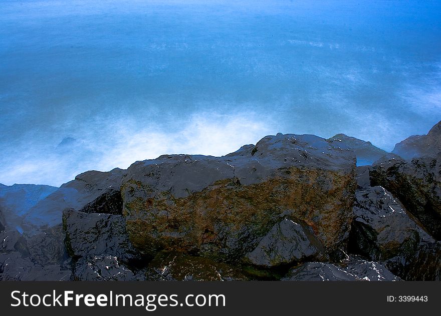 Landscape with rocks and blue sea in the evening. Landscape with rocks and blue sea in the evening