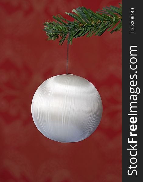 Christmas ball hanging on fir tree isolated