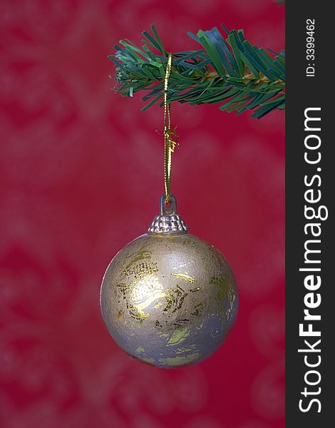 Christmas ball hanging on fir tree isolated