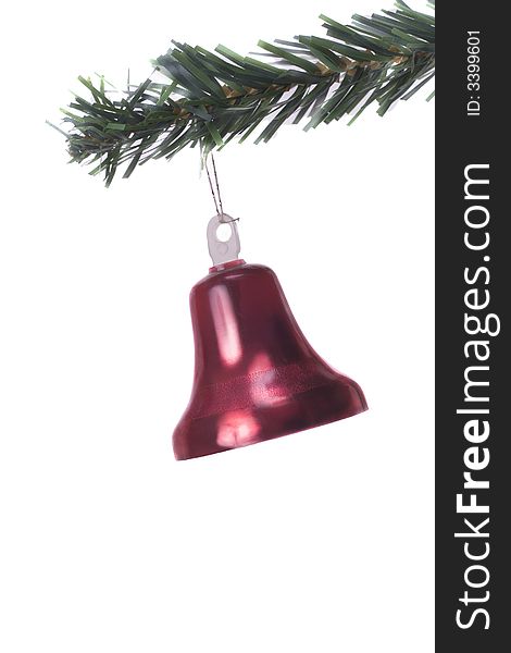 Christmas bell hanging on fir tree isolated