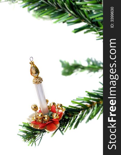 Christmas candle hanging on fir tree isolated