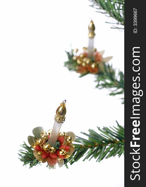 Christmas candle hanging on fir tree isolated