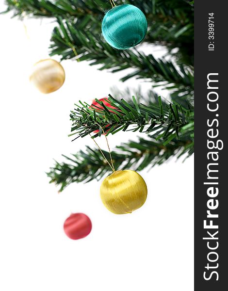 Christmas balls hanging on fir tree isolated