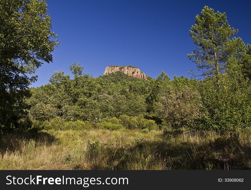 Colle Rousse, Red Rock Volcanic plugs above the Blavet Gorge, Bagnols en Foret, The Var France. Colle Rousse, Red Rock Volcanic plugs above the Blavet Gorge, Bagnols en Foret, The Var France