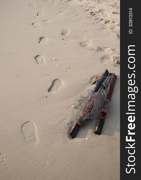 Garbage and footprint on the beach. Garbage and footprint on the beach