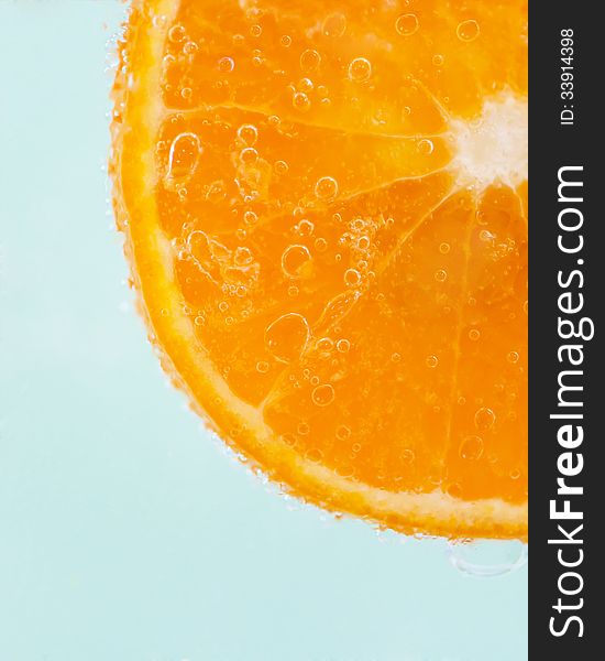 Orange slice and water droplets