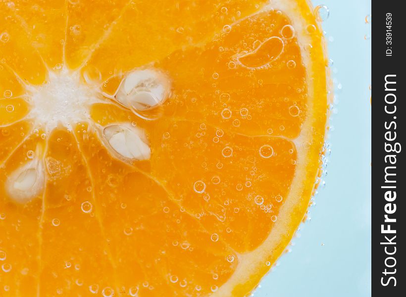 Orange slice and water droplets