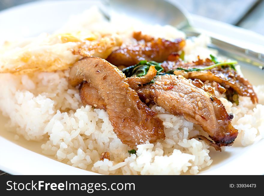 Rice with stir fried hot and spicy pork with basil