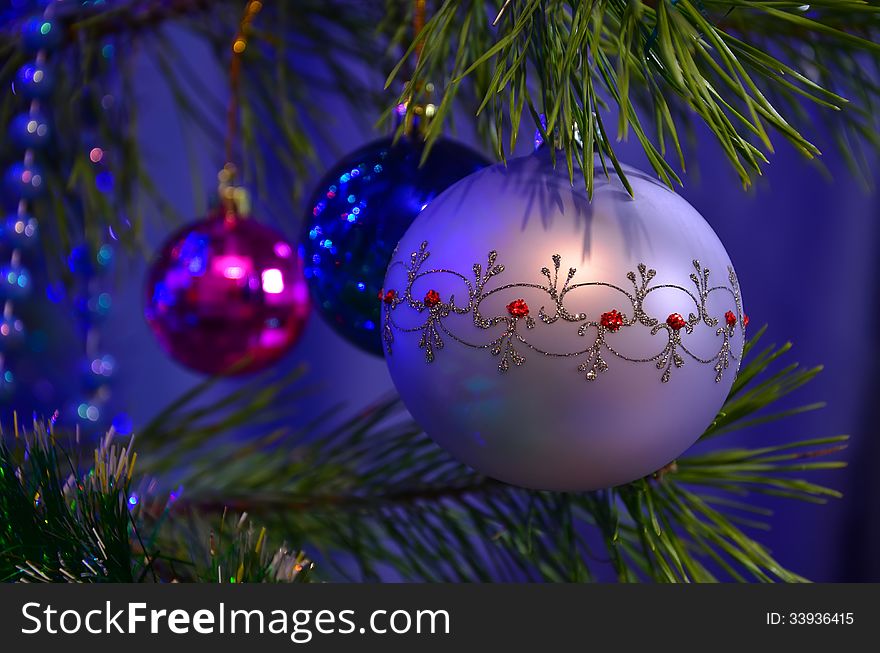 Christmas balls on pine tree. New Year background.