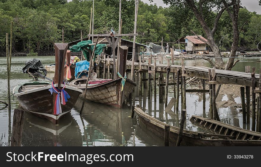 Environment around mangrove forest with wooden boats