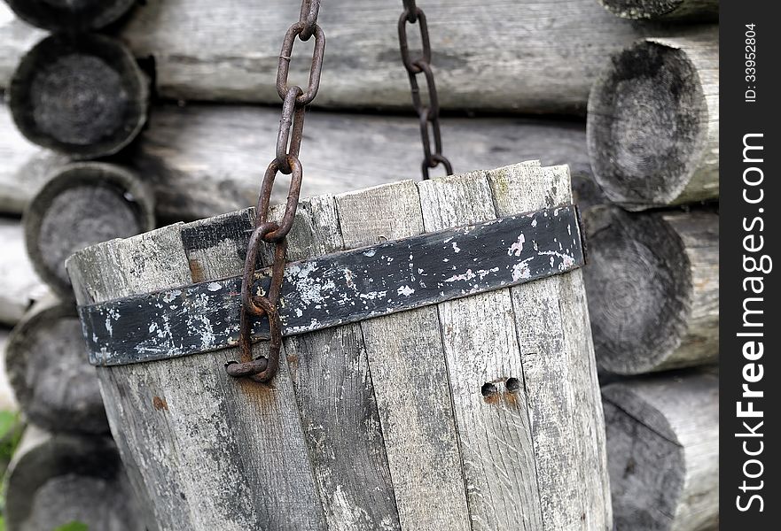 Close-up old wooden bucket. Old felling well background