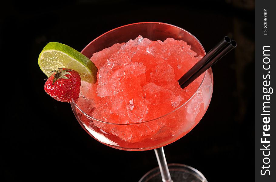 Strawberry margarita cocktail on black background