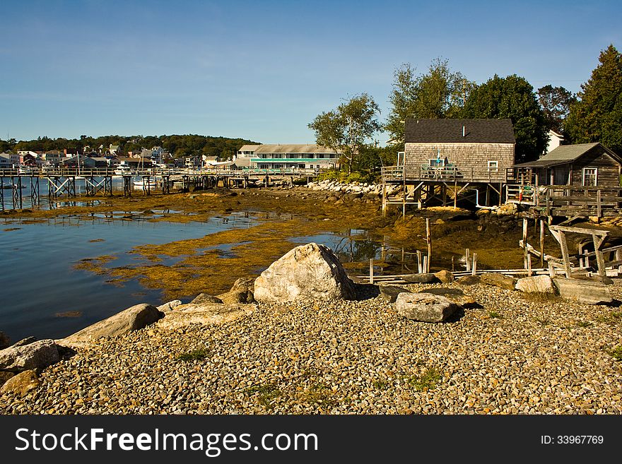 Buildings and docks in Maine at low tide. Buildings and docks in Maine at low tide.