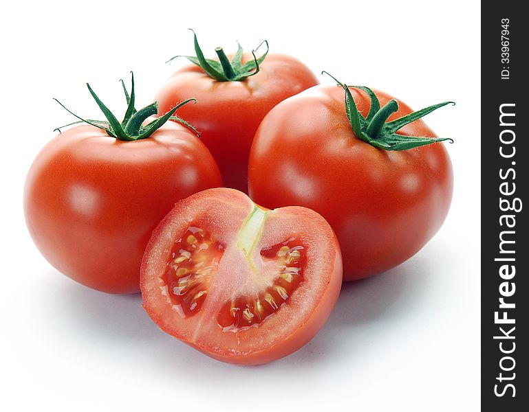 Red tomatoes and half on a white background