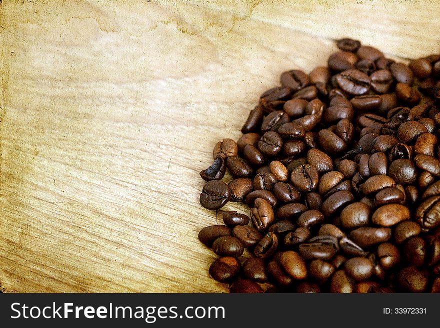 Coffee Beans On Vintage Wooden Background