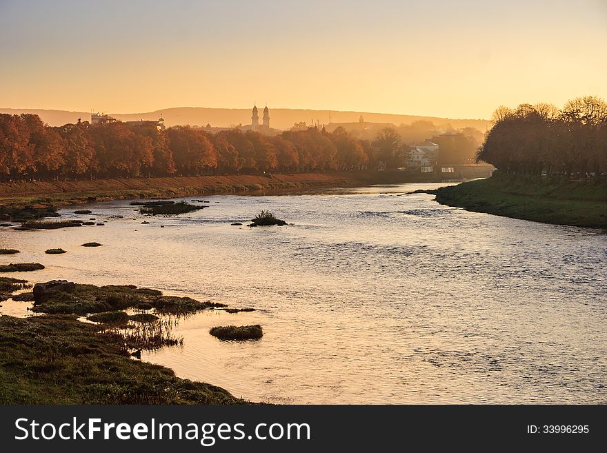 Old town autumn sunrise on the river