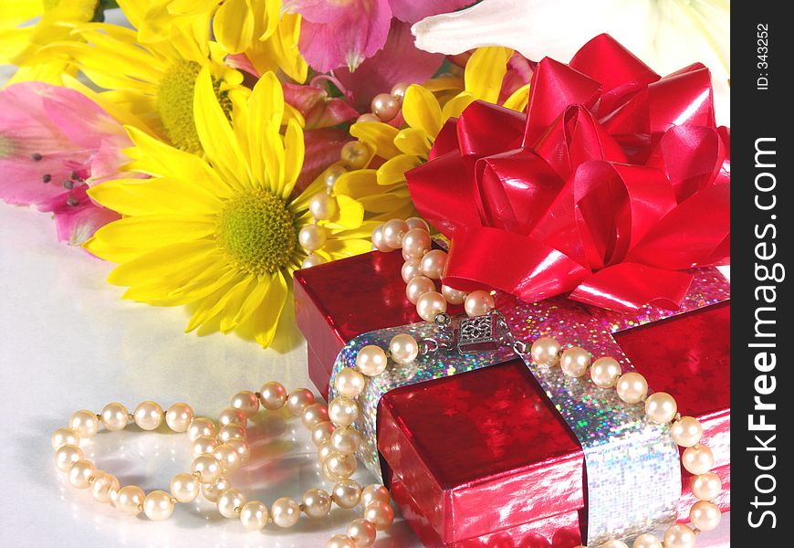 Present and flowers. Present and flowers