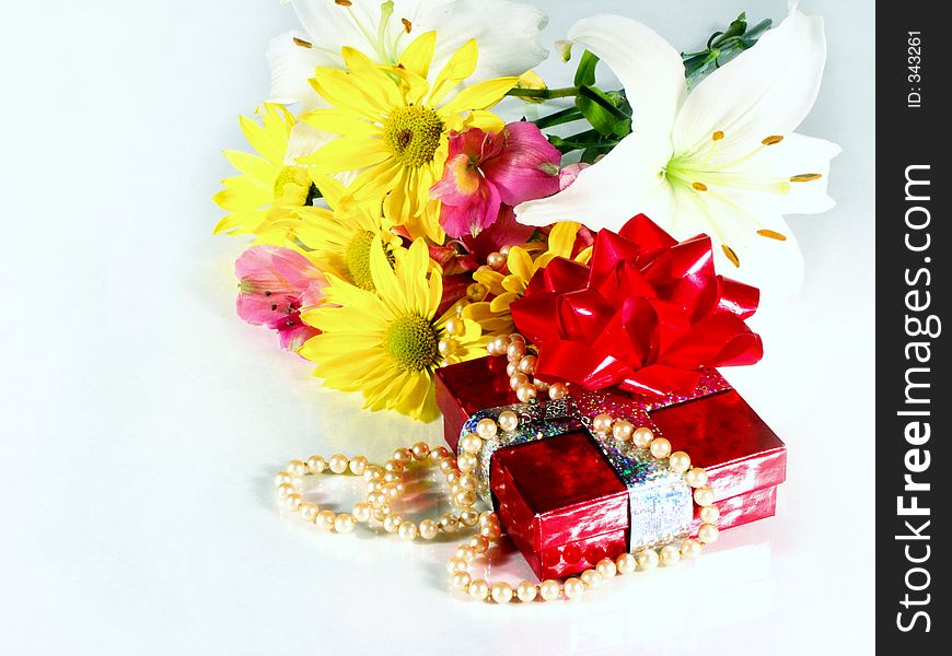 Present and flowers. Present and flowers