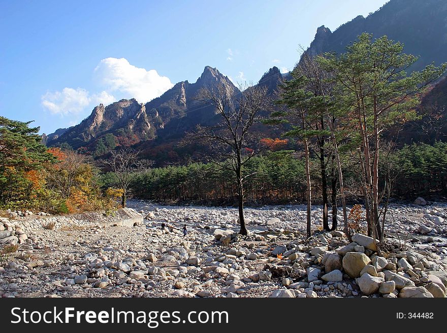 Dried up river bed with mountains in the background. Dried up river bed with mountains in the background