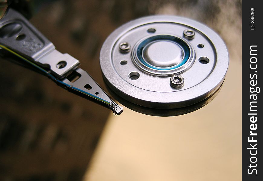 An open hard drive with sky reflection. An open hard drive with sky reflection