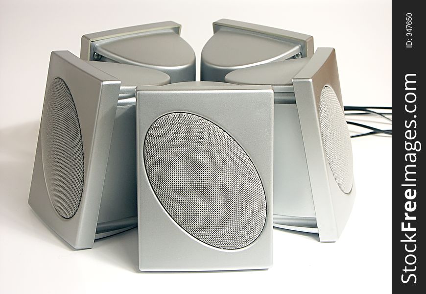 Five silver speakers