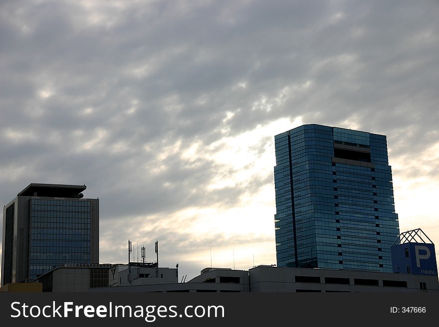 Modern architecture in japan; two towers in a cloudy day