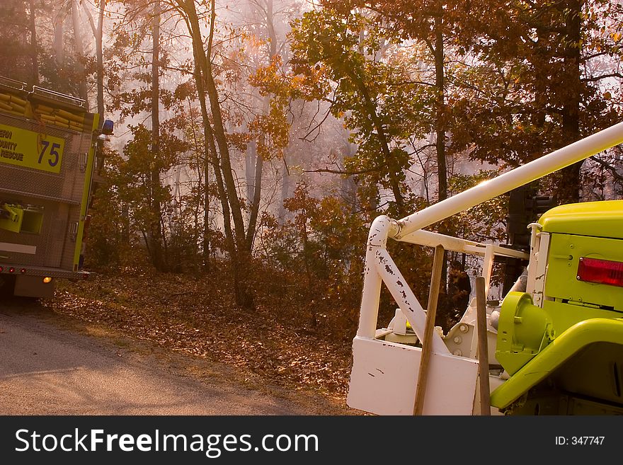 Some fire tenders parked by the highway while the crews fight this blaze in the Ozark Mountains