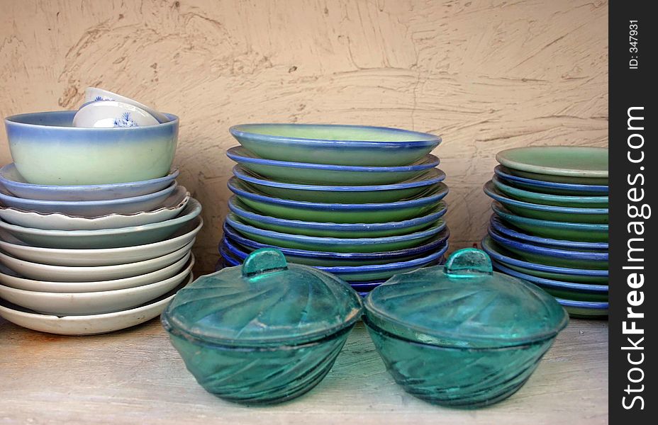 Piles of green and blue plates