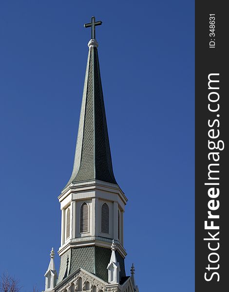 Church steeple isolated against a blue sky