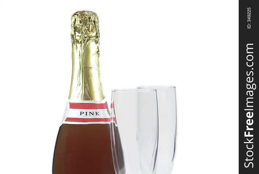 Champagne bottle with two champagne flutes isolated on white. Champagne bottle with two champagne flutes isolated on white.