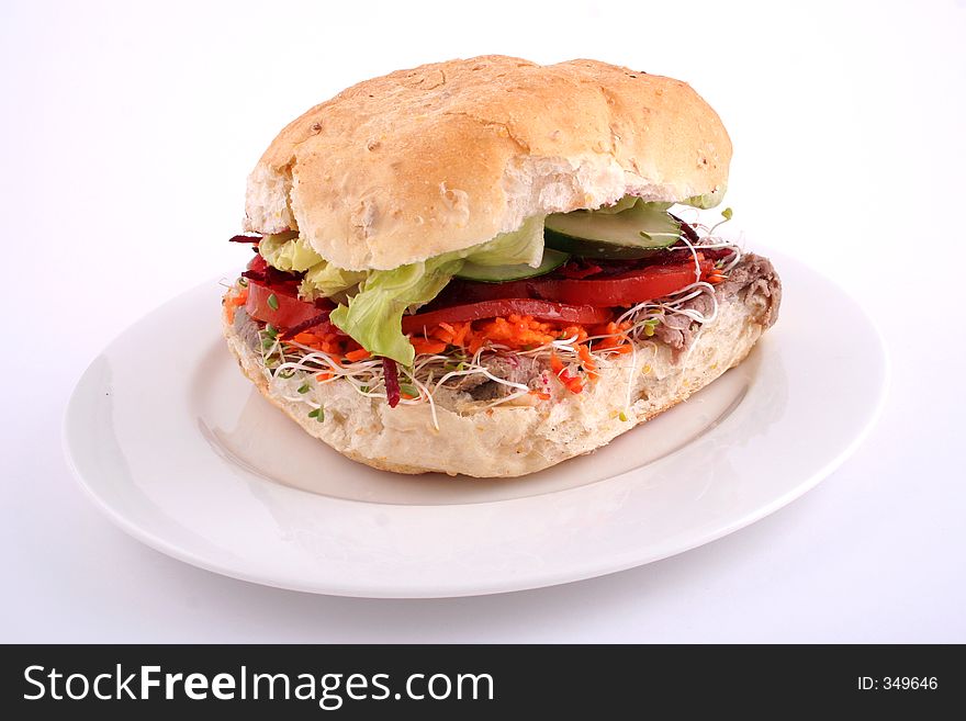 Fresh salad roll on a white plate and white background