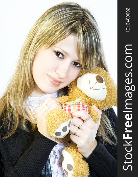 Young girl and yellow teddy. Young girl and yellow teddy