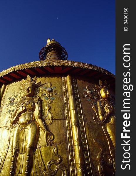 The golden buddha on the top of a tample(lamasery).Gansu,China.