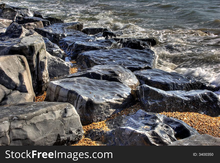 High Definition effect of rugged rocks on shoreline. High Definition effect of rugged rocks on shoreline