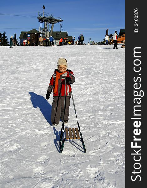 Winter time - Boy with sled