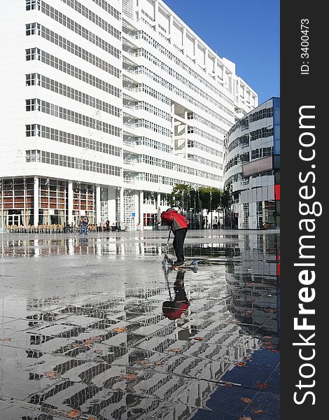 City Hall of The Hague, Holland, with child on kick scooter