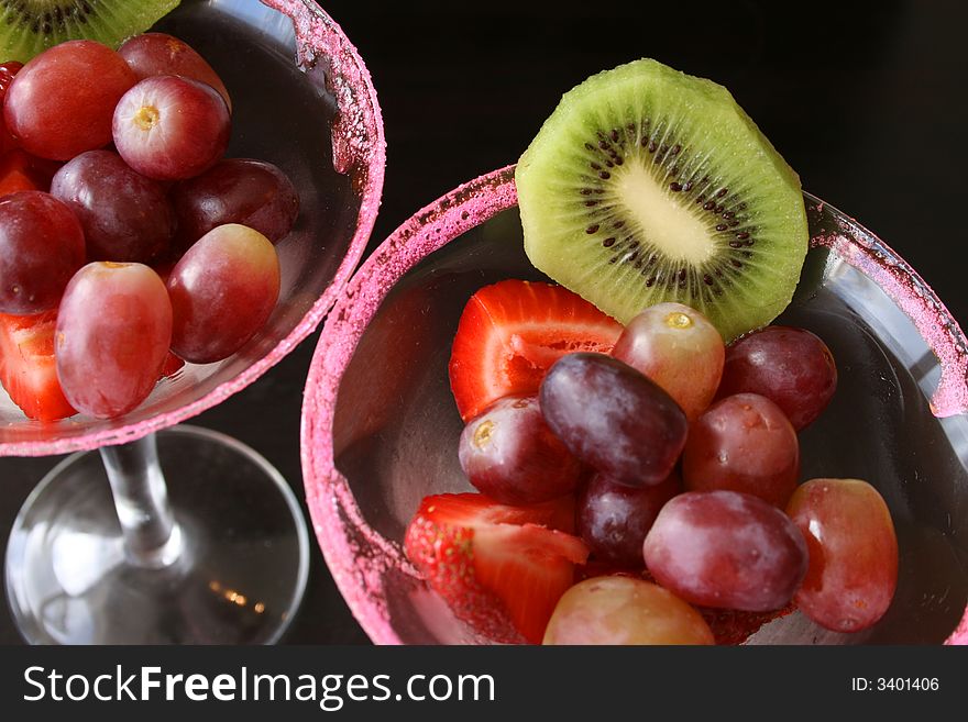 Fruit Salad in glasses with sugar crystals on the rim. Fruit Salad in glasses with sugar crystals on the rim