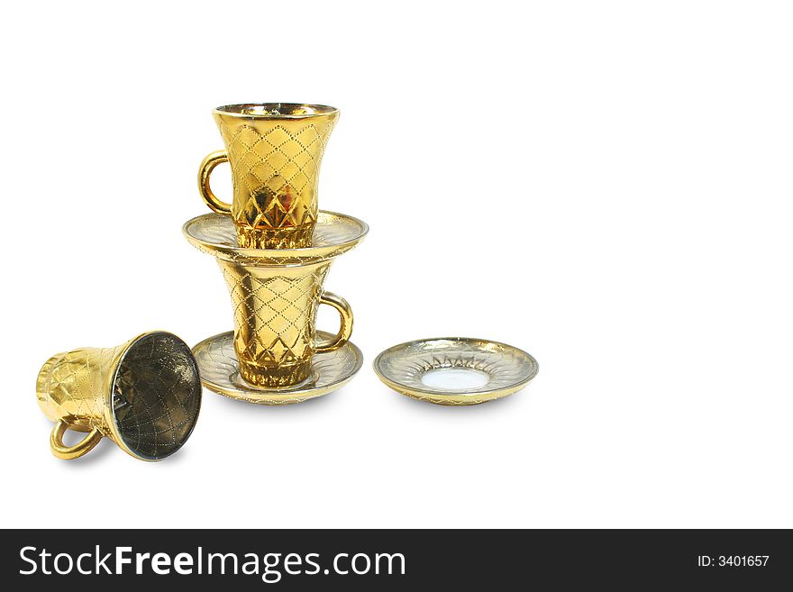 Two isolated gilt cups and two isolated gilt saucers. Two isolated gilt cups and two isolated gilt saucers