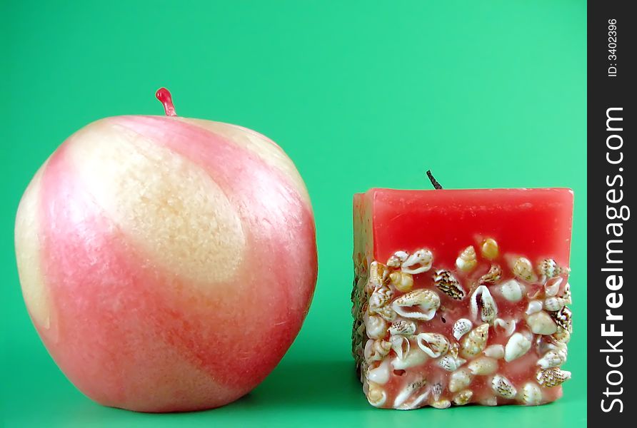 Image from home series: red candles on green background