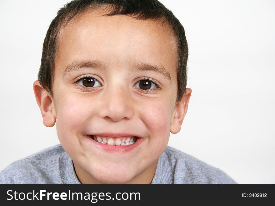 A young boy smiling at the camera