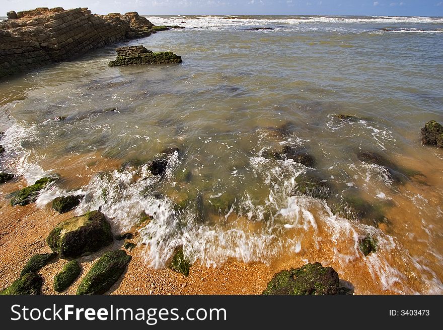 Coast of Mediterranean sea with big stones in water. Coast of Mediterranean sea with big stones in water