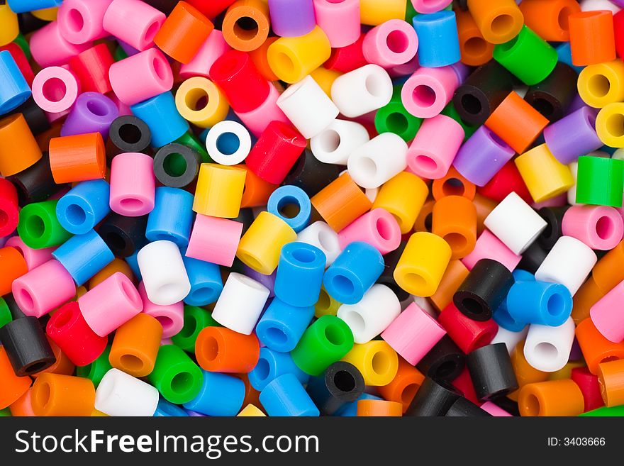 Randomly scattered colored beads, intended as background or wallpaper. Randomly scattered colored beads, intended as background or wallpaper