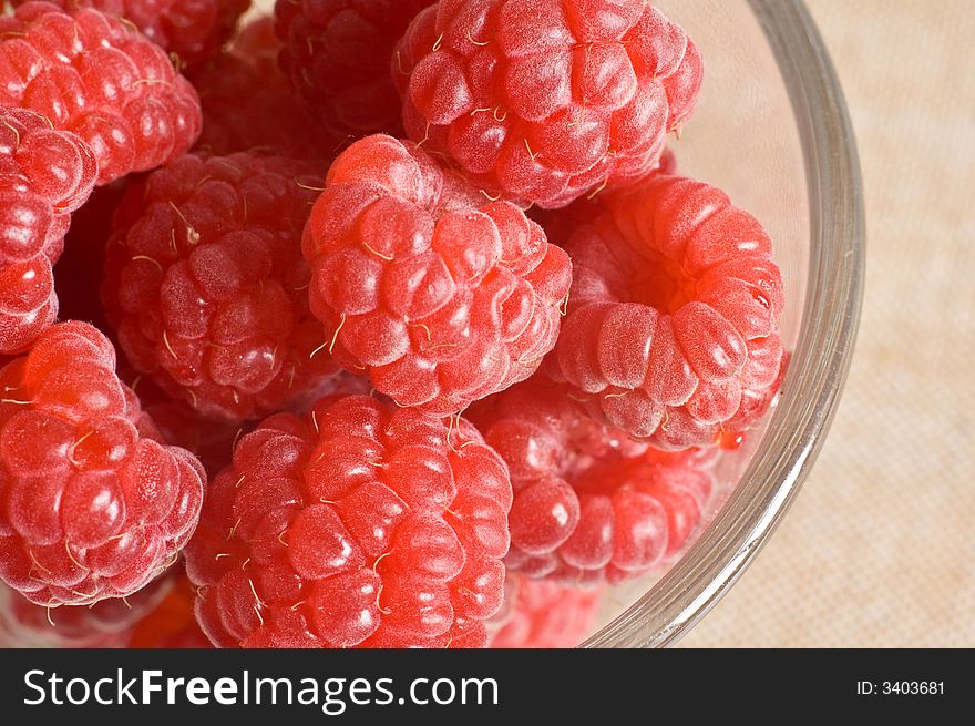 Garden fresh raspberries in a glass. Garden fresh raspberries in a glass