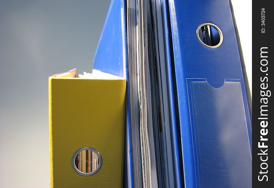 Stressed stack of papers office files.