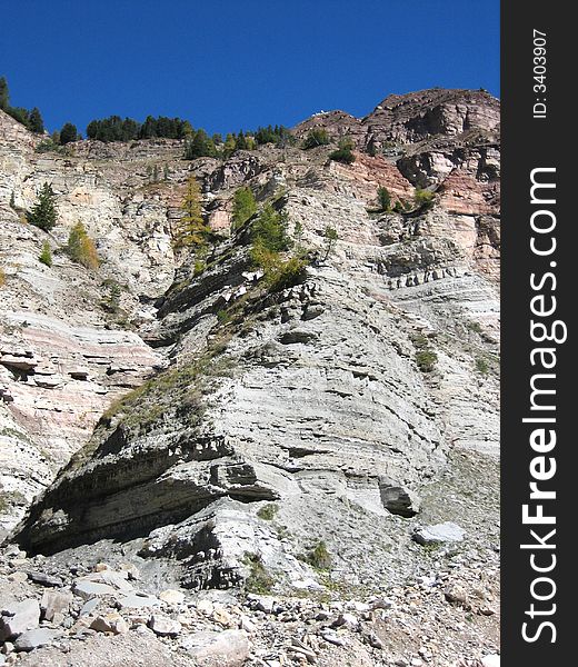 Hillside in the mountains in nature with rocks grass and other plants. Hillside in the mountains in nature with rocks grass and other plants