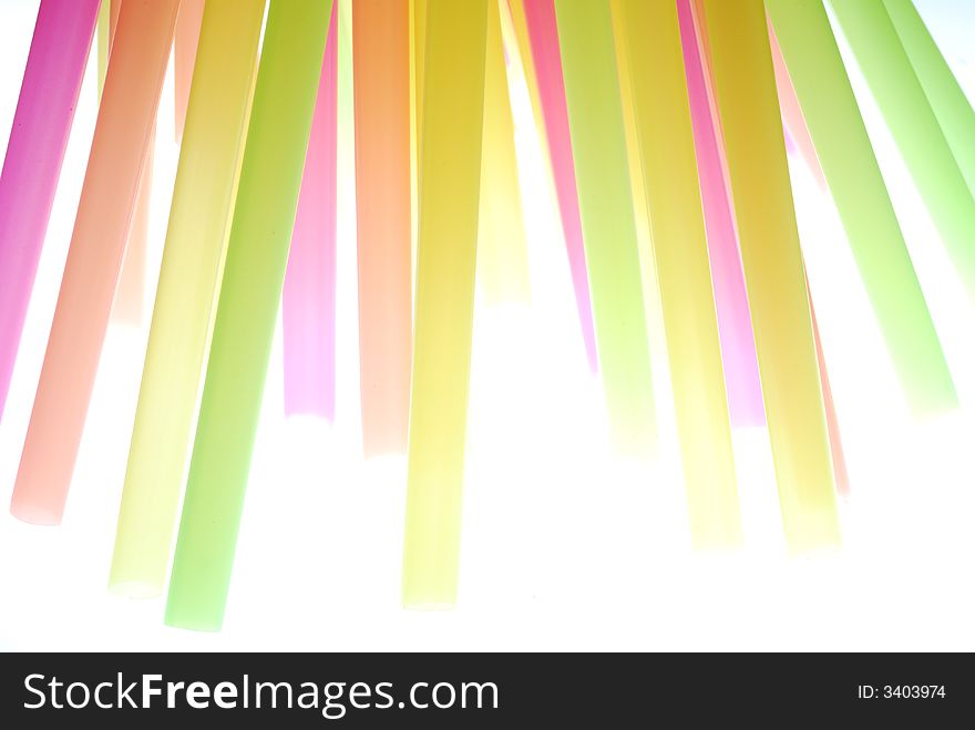 Color drinking straw standing on light box