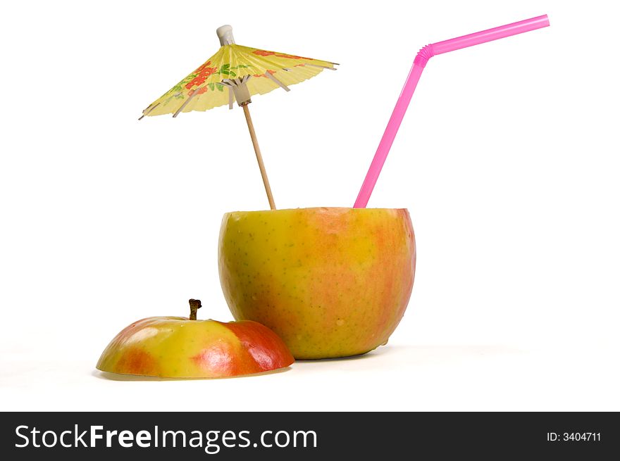 Apple with umbrella and straw on white background