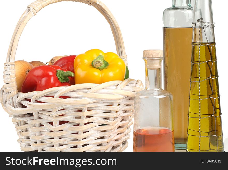 Still life of oil and basket with peppers. Still life of oil and basket with peppers