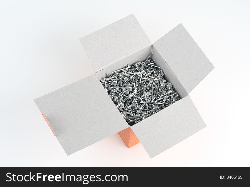 Rivets in a paper box. Rivets in a paper box